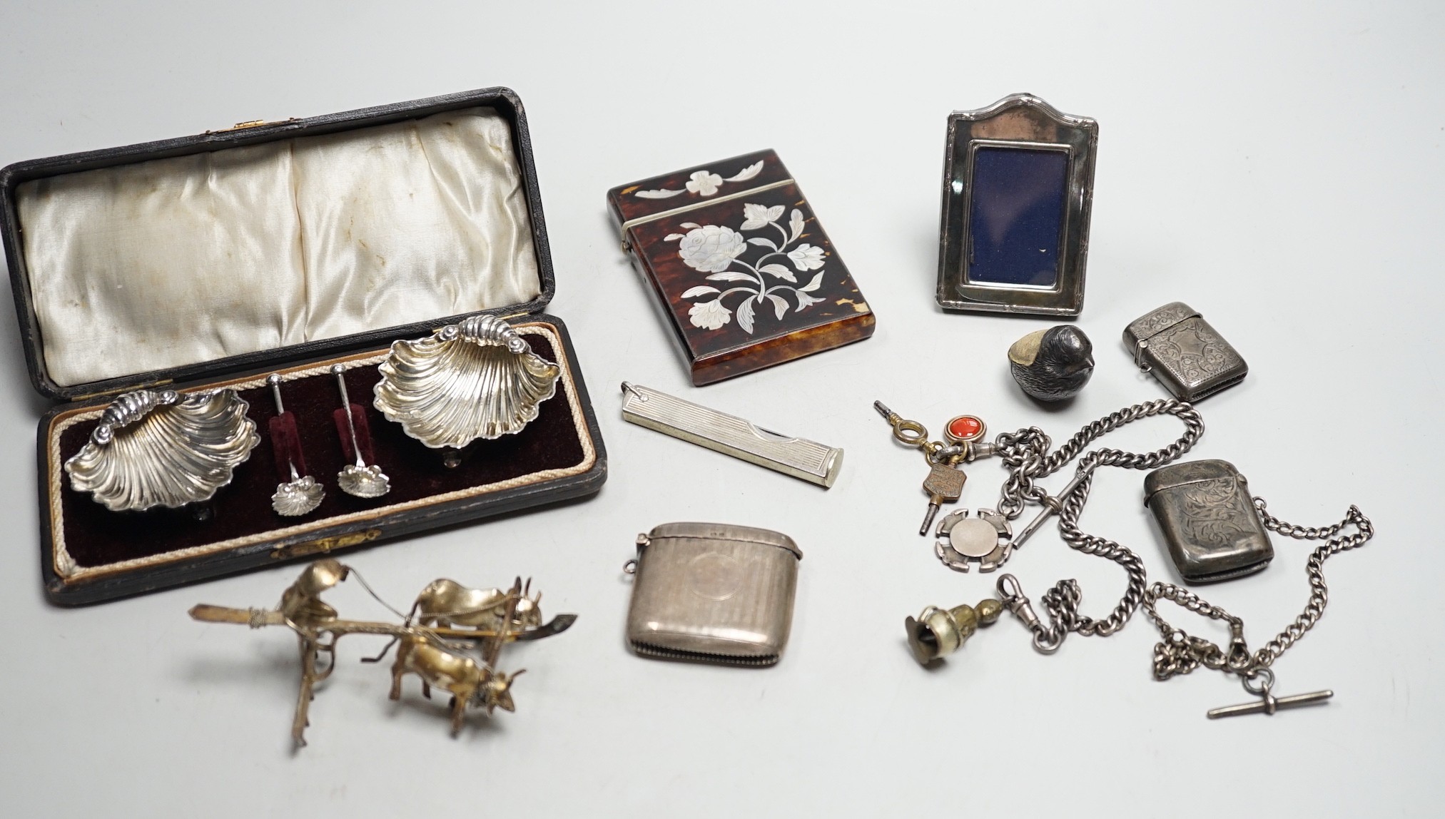 A cased pair of Edwardian silver shell salts, with spoons, and other items including Edwardian silver mounted bird pin cushion, by Sampson Mordan & Co, vesta cases, inlaid tortoiseshell card case etc.